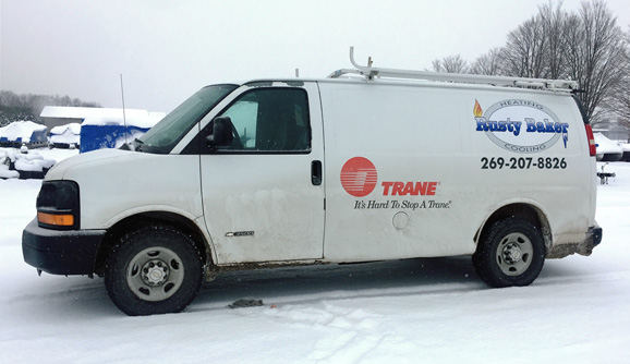 Rusty baker heating and cooling's work van in kalamazoo, michigan